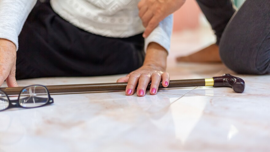 Senior woman falling down at home