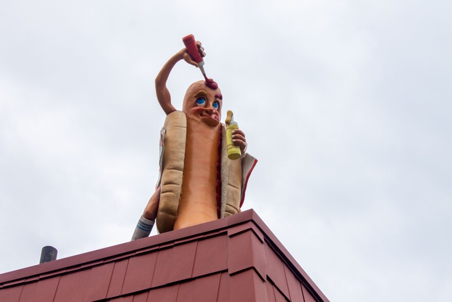 The Yocco's hotdog statue close-up.