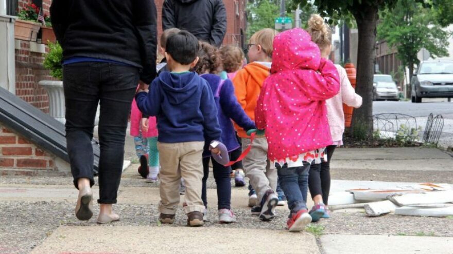 children-walking-down-street
