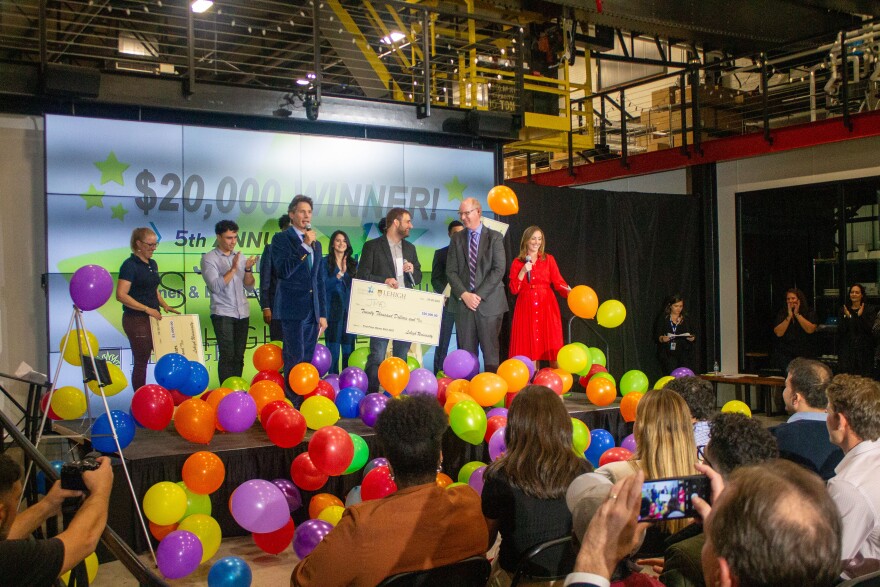Jmad Creations founder Jonathan Maderic accepting his prize money at Startup Lehigh Valley in Bethlehem