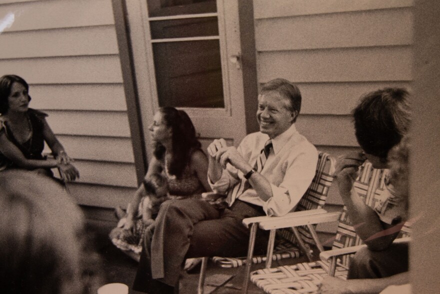 Rachelle Carmenucci, sitting to the left of Jimmy Carter.