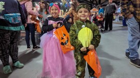 Children trick or treat on the concourse of Coca-Cola Park