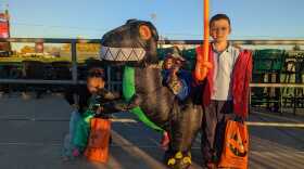 Children trick or treat on the concourse of Coca-Cola Park