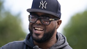 Terrence Floyd, brother of George Floyd, is working with the organization Confront Art to release 9,000 non-fungible tokens, or NFTs, on mintNFT.com on April 15 in a campaign to raise funds for various charities. Here, he speaks at the unveiling of sculptures of George Floyd, Breonna Taylor and the late Rep. John Lewis in New York City on Sept. 30, 2021.