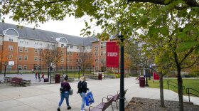 Students walk on the campus of Indiana University of Pennsylvania in Indiana, Pa, on Wednesday, Oct. 21, 2020.