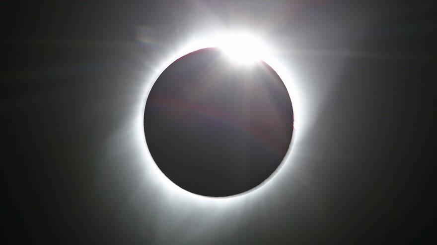 The sun is shown in the first phase of a total eclipse in this photo taken in August 2017 from Grand Teton National Park outside Jackson, Wyo.