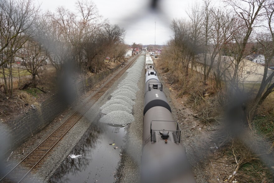 A Norfolk Southern train runs through East Palestine less than two weeks after a derailment on Feb. 3.