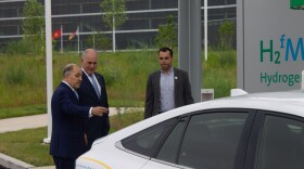 Sen. Bob Casey has a look at a hydrogen-powered Toyota at Air Products in Lower Macungie