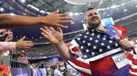 Joe Kovacs with American flag