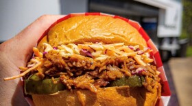 Paranormal Pizza pulled porkless sandwich with slaw and pickles