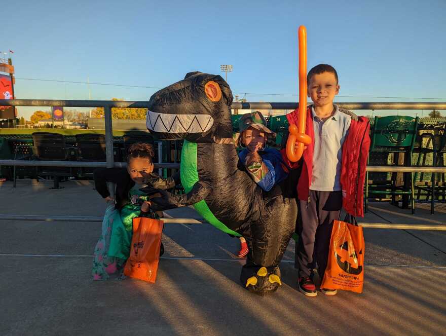 Children trick or treat on the concourse of Coca-Cola Park