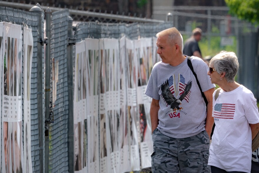 People observing "Our Hometown Heroes"