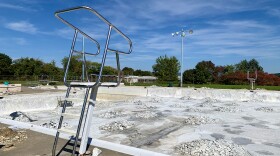 The Northern Lehigh Swimming Pool drained out with piles of rubble at the bottom.