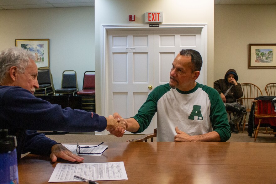 Jeff Carlton shakes hands with Elvis Espinar