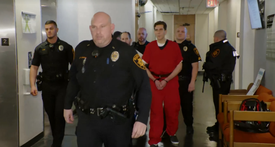 Image of the accused, Bryan Kohberger, being led into the courtroom.