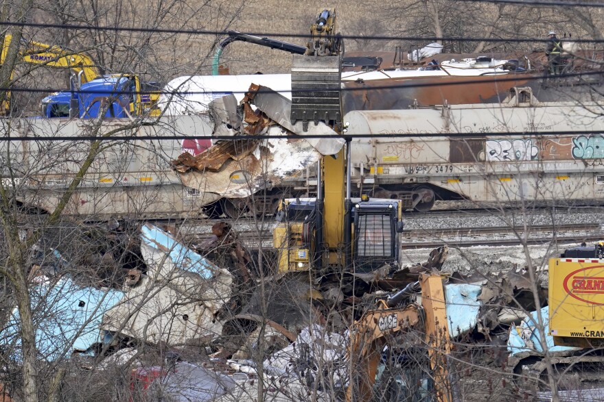 Workers continue to clean up remaining tank cars, Tuesday, Feb. 21, 2023, in East Palestine, Ohio, following the Feb. 3 Norfolk Southern freight train derailment. 