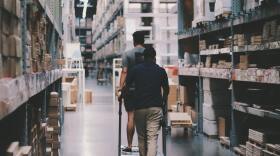 men-going-around-a-warehouse