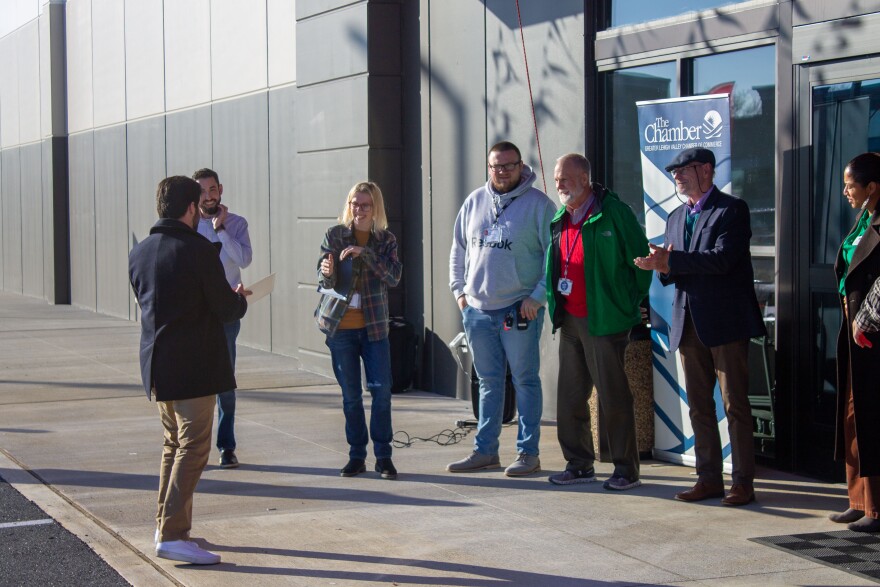 Store staff, local government officials stand outside at the informal opening of Floor & Decor in Whitehall.