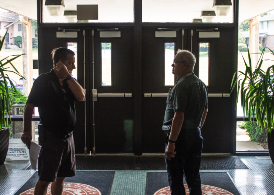 Ray Boris and a colleague in the hallway of Bethlehem Catholic High School.