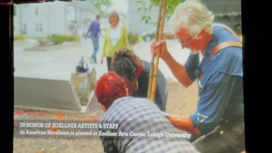 Bill George planted a tree as seen in "Rooted"