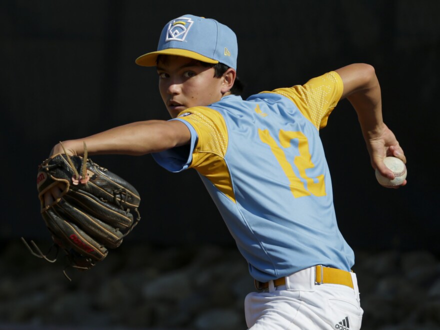 Daly Watson #12 of the West Region team from Honolulu, Hawaii warms up in the bullpen during the third inning of the Little League World Series Championship game against the Caribbean Region team from Willemstad, Curacao at the Little League International Complex on August 28, 2022 in South Williamsport, Pennsylvania.