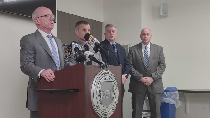 Houck glass news conference.jpg