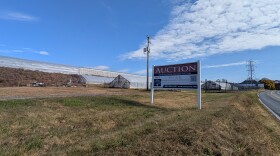 Dan Schantz Greenhouse with an Auction sign