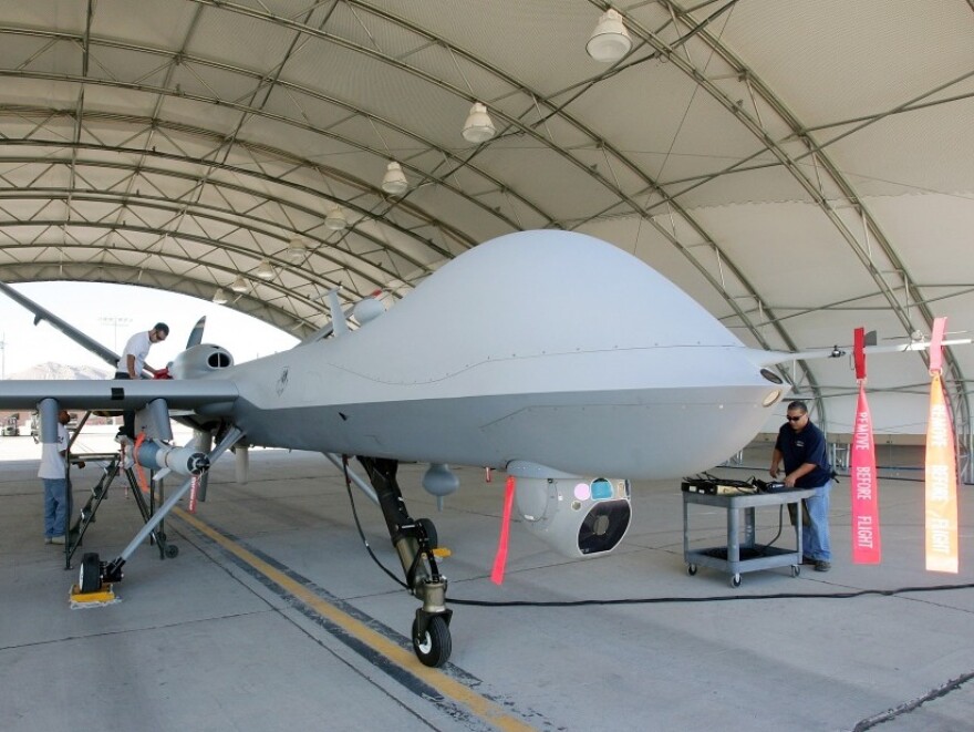 Mechanics prepare an MQ-9 Reaper for a training flight, Aug. 8, 2007, at Creech Air Force Base in Indian Springs, Nev. 