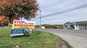 A sign protesting new warehouses in Lowhill Township.