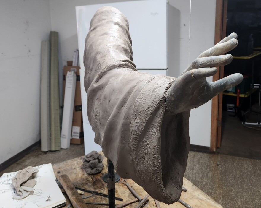 arm statue