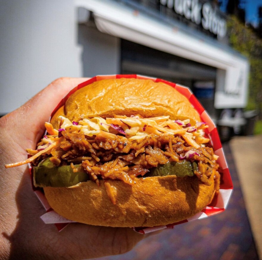 Paranormal Pizza pulled porkless sandwich with slaw and pickles