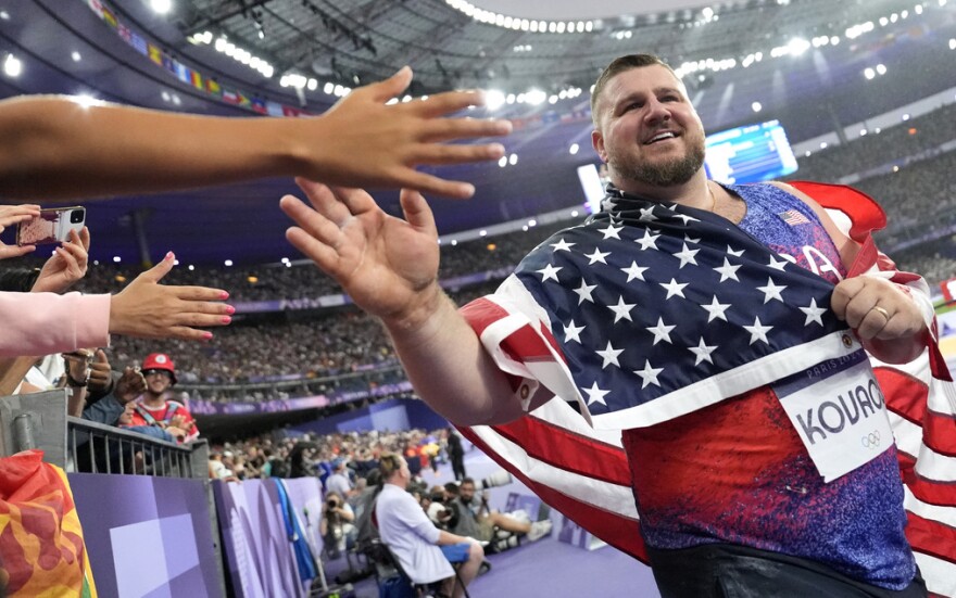 Joe Kovacs with American flag