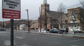 A church in the background, with a parking lot in the foreground and a sign that reads "St. John's Windish Lutheran Church Authorized Parking Only."