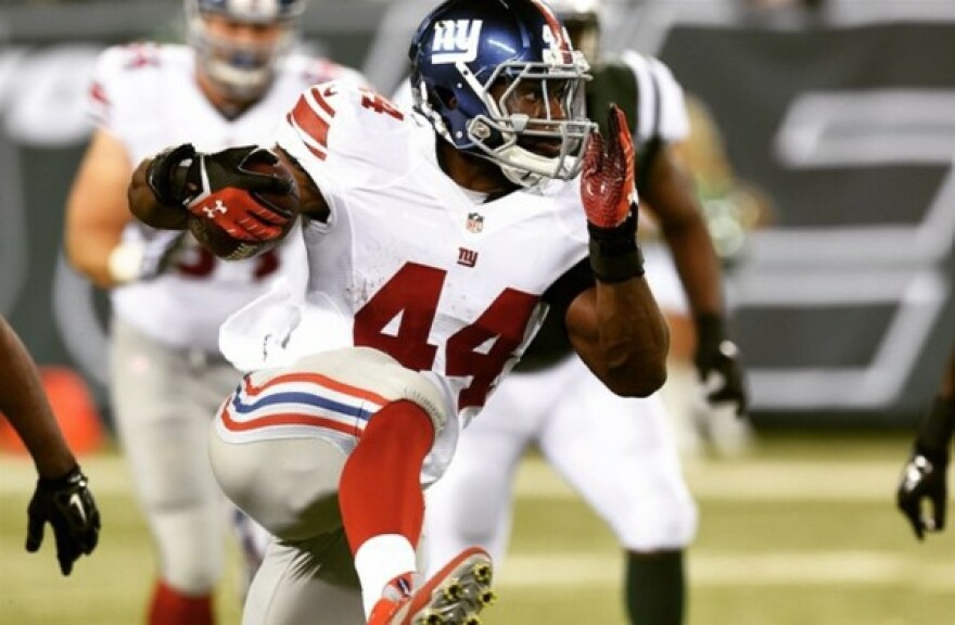 Andre Williams playing football