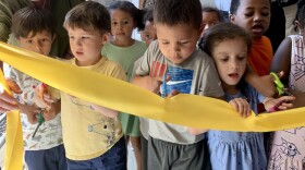 Children at Third Street Alliance for Women and Children cut ribbon on new preschool classrooms