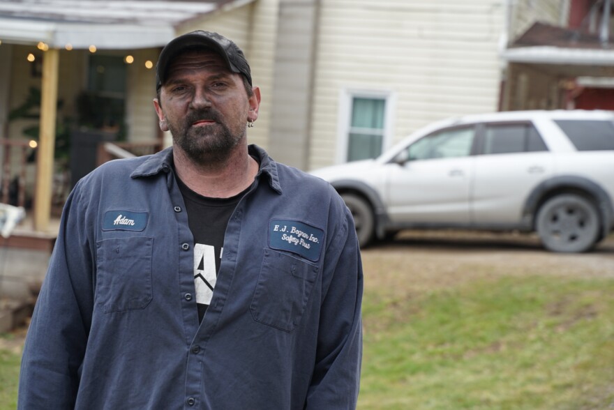  Adam Cornwell stopped by his house to check on his dog during a lunch break from his job using heavy equipment to load coal for steel companies.