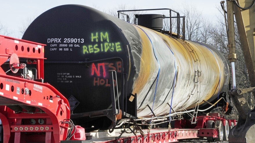 A tank car sits on a trailer as the cleanup of portions of a Norfolk Southern freight train that derailed in East Palestine, Ohio.