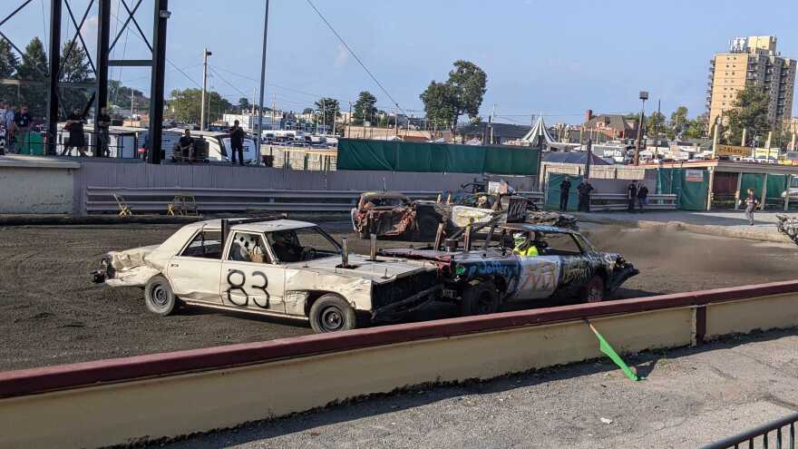 Two cars ramming each other in the Allentown Fair's demolition derby