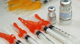 Bivalent COVID-19 vaccines are readied for use at a clinic in Richmond, Va., Nov. 2022. Just 15% of eligible Americans have gotten the most recent booster shot, according to the CDC.