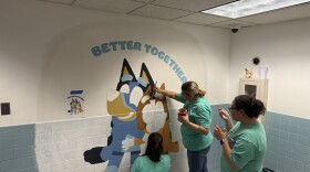 Painting a mural at Central Elementary United Way of Caring