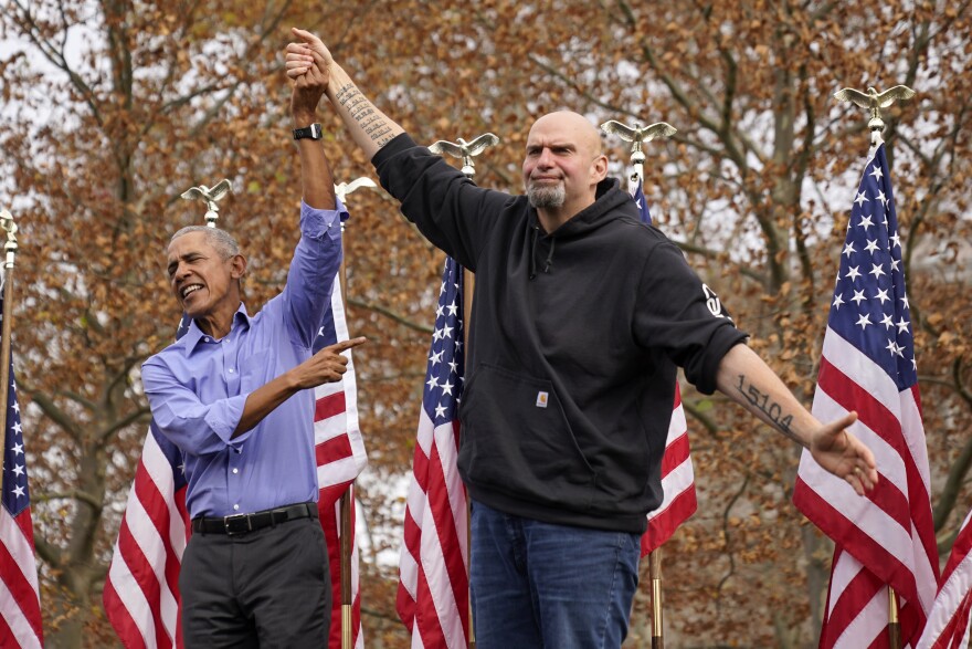 Former President Barack Obama, left, finishes his remarks and welcomes Pennsylvania Lt. Gov. John Fetterman, a Democratic candidate for U.S. Senate, to the stage during a campaign rally in Pittsburgh, Saturday, Nov. 5, 2022.